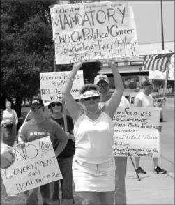 Eric Prince| Staff
Protesters confine their dialogue to what fits on a poster board at an Aug 20 rally in Dallas. 