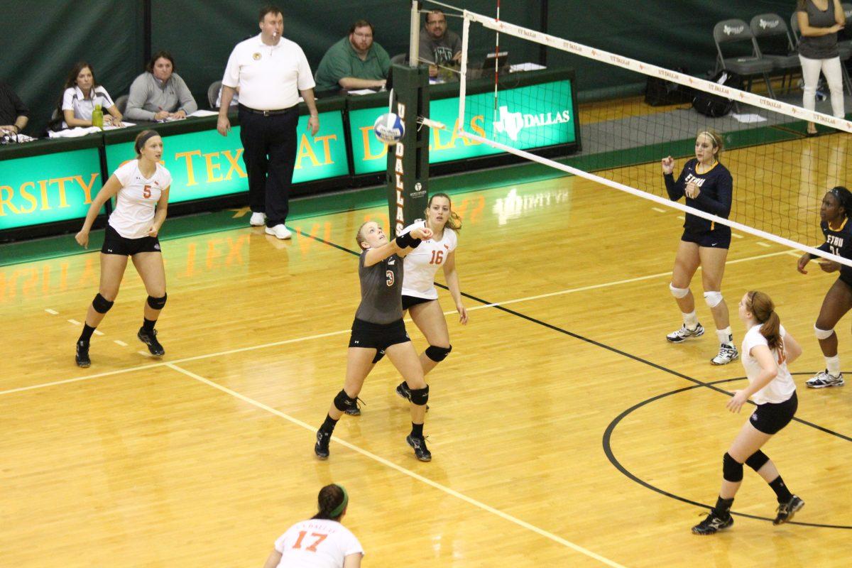 Sophomore setter Bethany Werner defends a ball as it floats over the net during UTD's conference opening win over ETBU. 