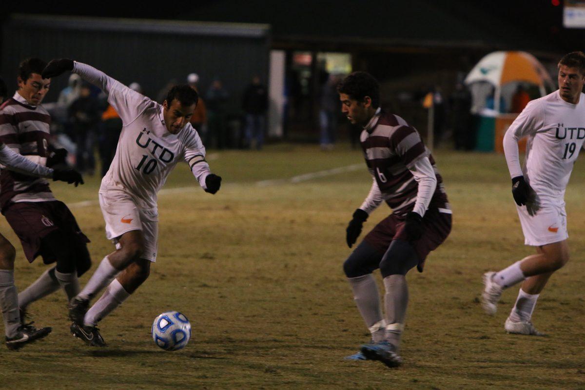 Andrew Gallegos|Staff Photographer
Senior forward Omar Jaroun fights for possession of the ball against two Trinity defenders. Trinity beat UTD 1-0 to advance to the Sweet Sixteen.