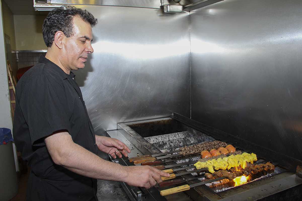 Arun Prasath|Staff
Chef Dean Budri of Kabobi Fresh Mediterranean cooks beef, chicken and vegetables on a shish kabob for a lunch party. His food is inspired by a variety of world cuisines like Afhgan, Arabic and Mediterranean foods, among others.

