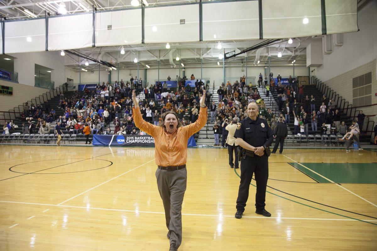 Head coach Polly Thomason pumps up the crowd after UTD's 67-65 victory over UT Tyler in the second round of the NCAA tournament.
