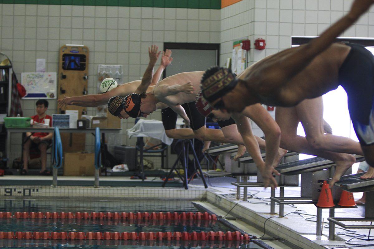 Arun Prasath|Staff
Colin Campbell (center) and members of swim teams from the Southwest Swim League compete at the championship meet held on April 11 at UTD. UTD’s men’s team finished in first place and the women’s team finished in second, despite having only five members. The swim team, along with the gymnastics team and the table tennis team, all qualified to go to national tournaments this year.