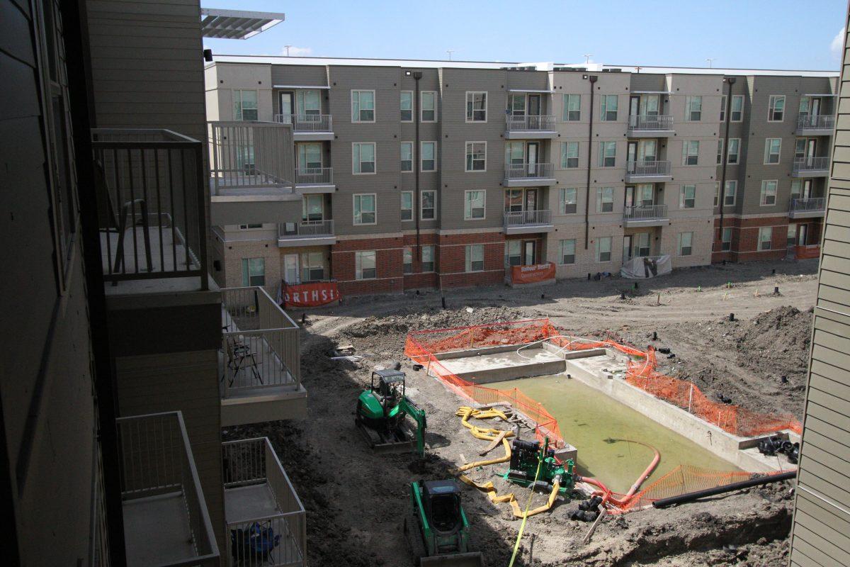 Northside, the new apartment complex on Synergy Park Boulevard, moved in all of its residents by Sept. 15. The pool (above) is one of the amenities that won’t be complete until around fall break. Photo by Saher Aqeel | Assistant Photo Editor.