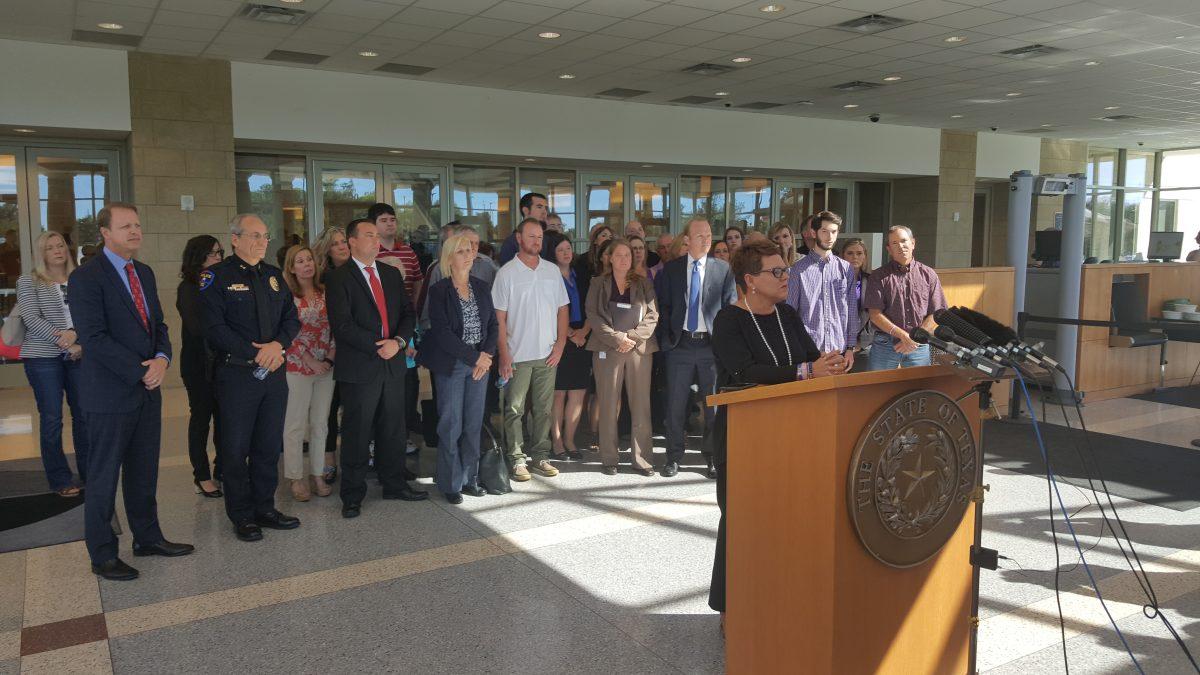 Jonni McElroy (far right) spoke at the press conference on Sept. 30 at the Collin Country courthouse after the trial of Enrique Arochi ended. Arochi has been sentenced to life in prison for the aggravated kidnapping of Christina Morris, a UTD alumna. McElroy, who is Morris’ mother, said the search for Morris will continue until she is found. Photo by Esteban Bustillos | Mercury Staff.