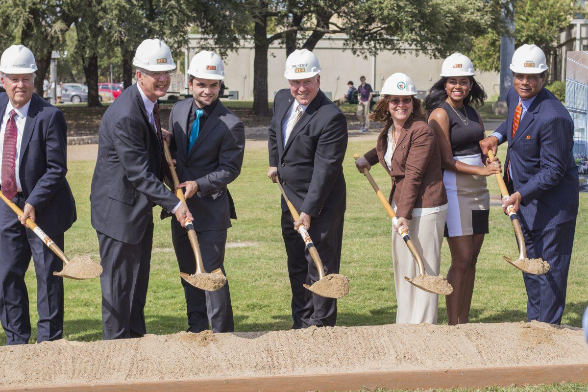 Richard Benson (center), the university president, was joined by UTD officials and members of Student Government, such as SG President Akshitha Padigela (second from right) and SG Vice President Joey Campain (third from left) at the groundbreaking of the new engineering building on Oct. 6. The 200,000 square-foot project is set to be complete in the summer of 2018 and will cost $110 million. Photo by Chris Lin | Mercury Staff.