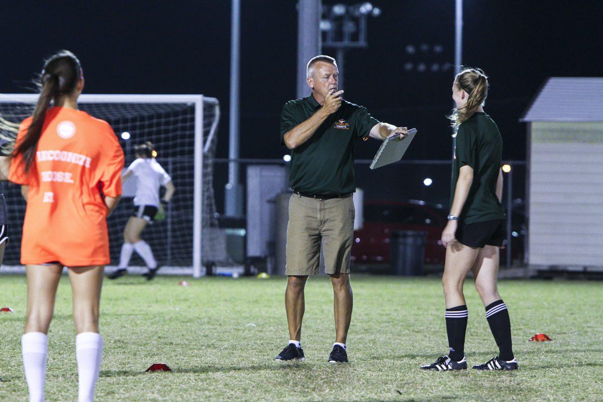 Women’s head soccer coach Kanute Drugan instructs the team during practice on Oct. 11. Drugan took over the head coaching position in 2014. Under Drugan, the team has posted two winning seasons with an overall 27-13-1 record. Photo by Hussein Njoroge | Mercury Staff.