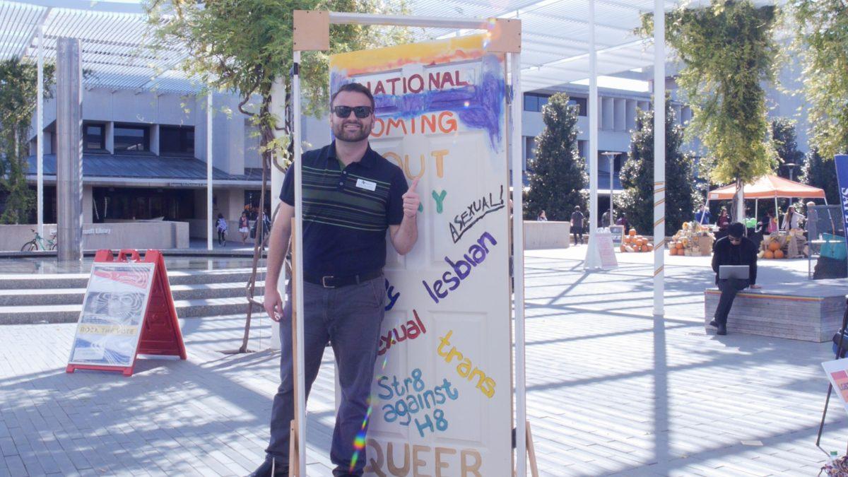 Matt Johns, the new assistant director of LGBT+ programming at the Galerstein Women’s Center, attends the National Coming Out Day celebration on the Plinth on Oct. 11. Photo courtesy of UTD TV.