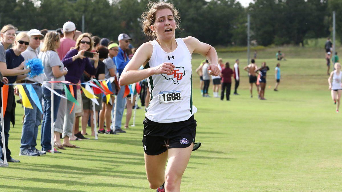 Junior Lindsey Rayborn runs to the finish line during the ASC Championship meet held at the Balcones-Spicewood Cross-Country Course on Oct. 29. The Comets captured their first ever ASC championship. Rayborn became the first Comet, male or female, to win the individual ASC title. Photo courtesy of Comet Sports.
