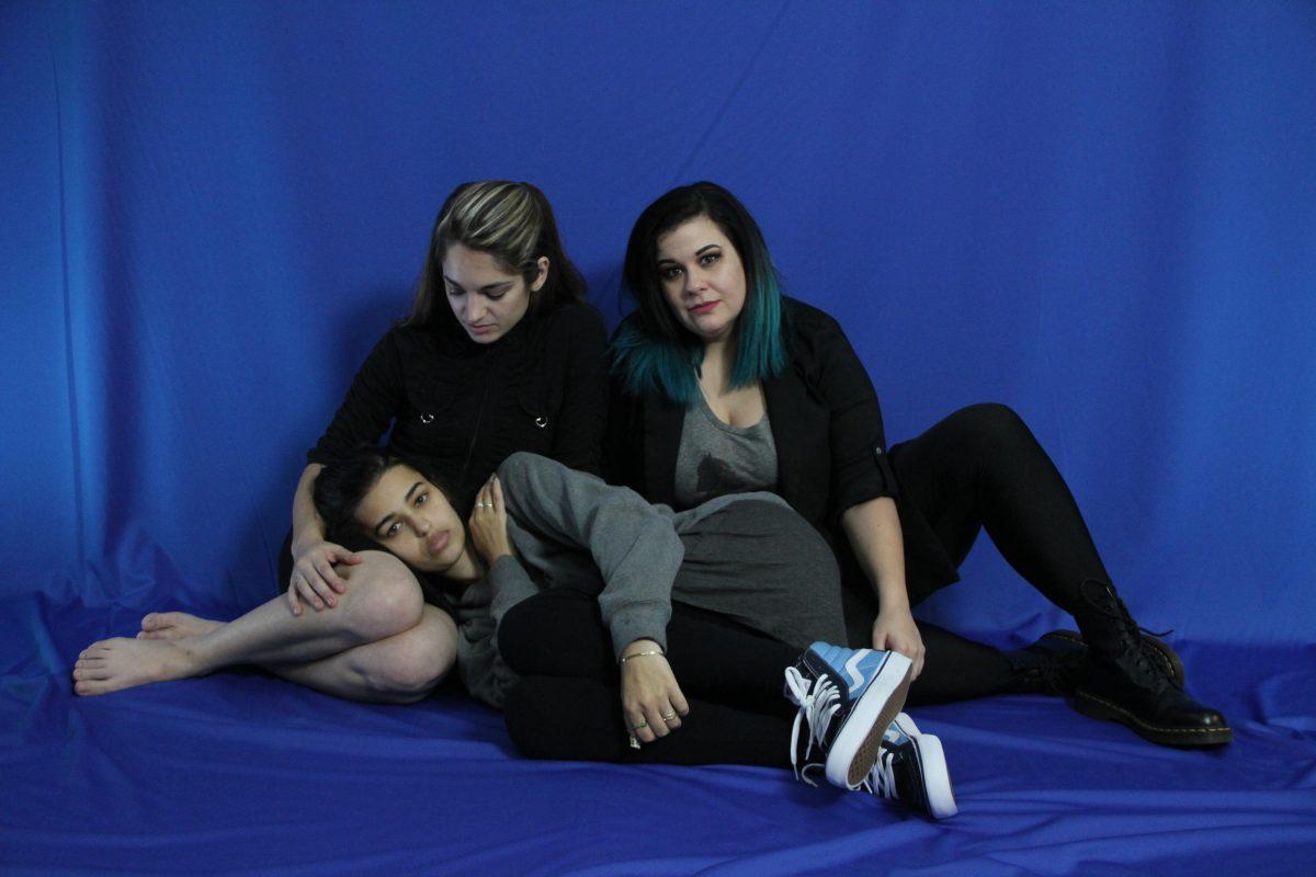 (Left to right) Virginia Beam, Mimi Newman and Caitlin Rogers support one another to help cope with their depression. Photo by Saher Aqeel | Assistant Photo Editor.