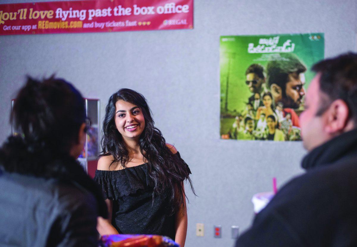 Finance freshman Sasha Singh helps promote her role in Telugu film “Appatlo Okadundevadu” at a signing at Regal Cinema in Irving on Jan. 6. Despite Singh’s unfamiliarity with the Telugu language and acting on screen, she said it was a successful venture. Photo by Hussein Njoroge | Mercury Staff.