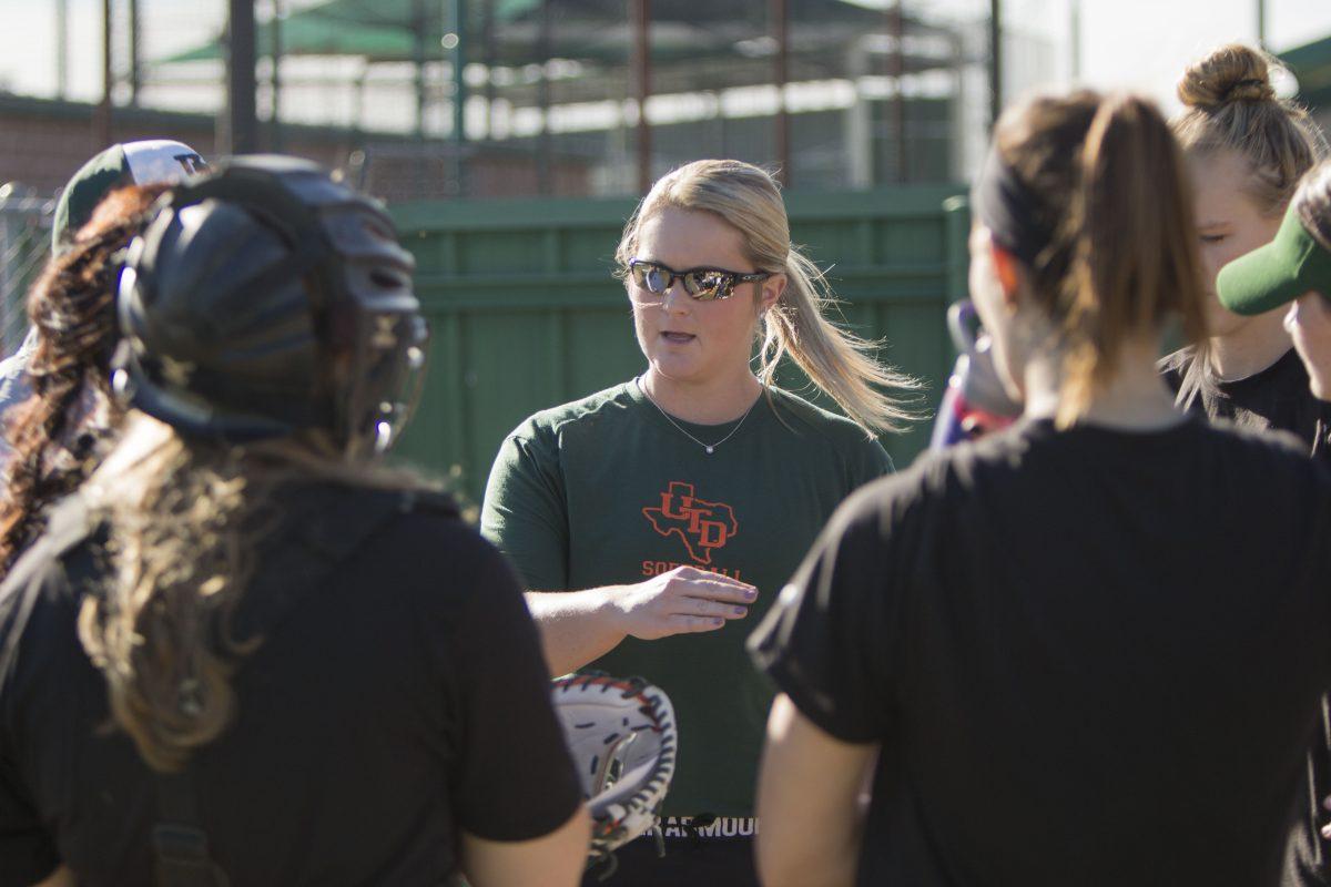 Assistant coach Rayn House instructs student-athletes during an afternoon practice as they get ready for their upcoming season opener, a double header on Feb. 2 against Pacific. House is in her first season at UTD and has already coached the women’s cross-country team to an ASC title in the fall. Photo by Chris Lin | Mercury Staff.