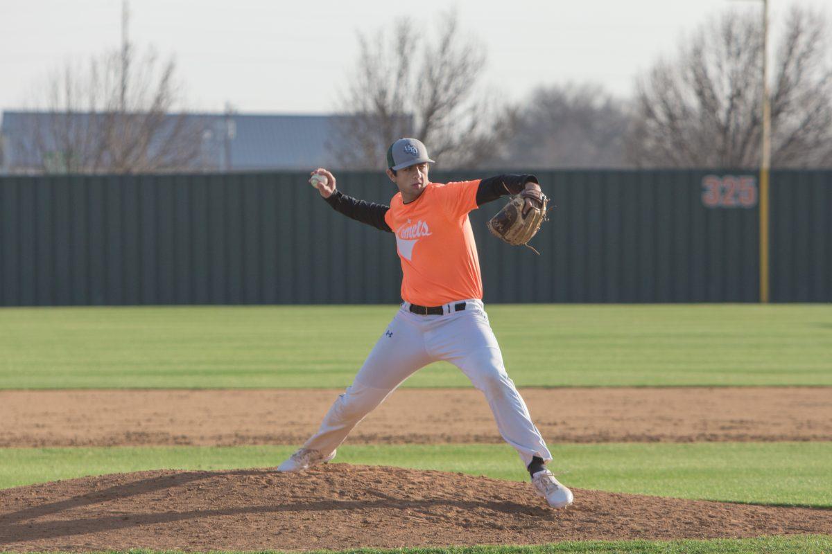 Freshman Josiah Rohne works on his pitch during an intersquad game on Feb. 3, a week before the season opens on Feb. 10. The Comets were ranked fifth in the ASC’s preseason poll after losing all but three members of the starting line up to graduation. Photo by Chris Lin | Mercury Staff.