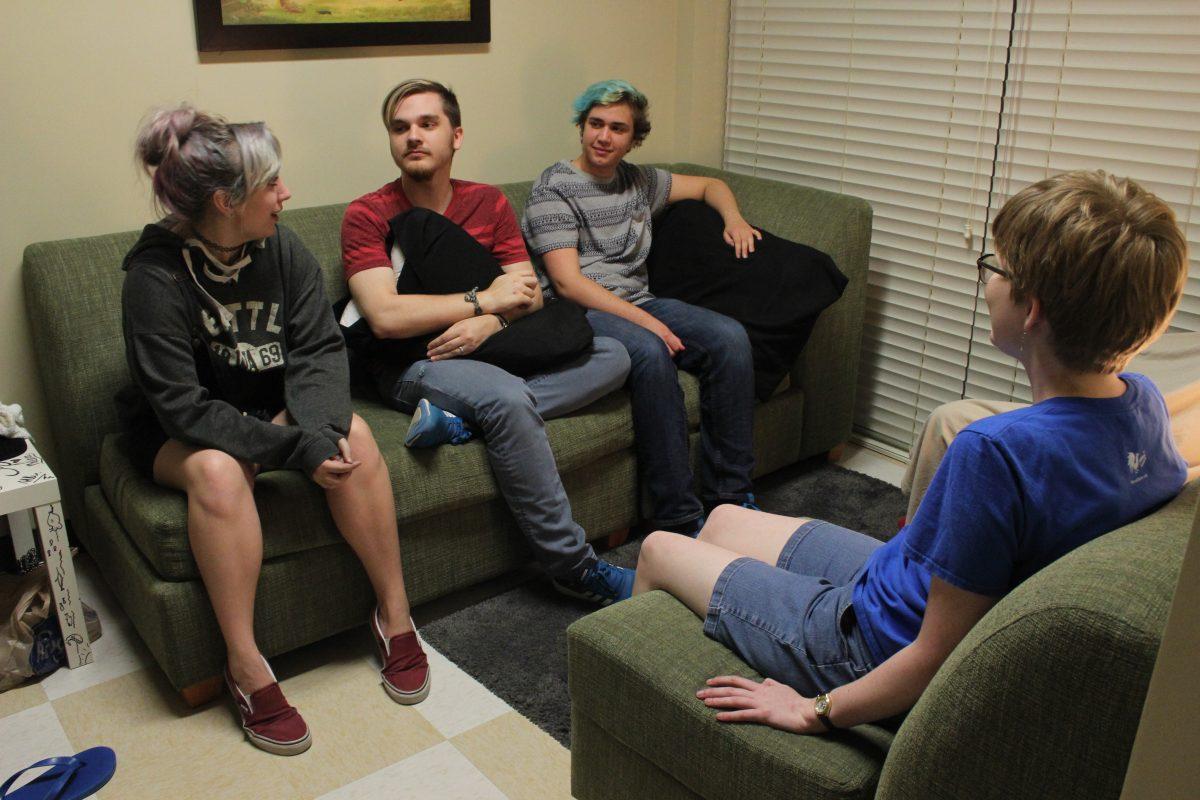Samuel Price (second from left), an ATEC freshman, and Akira Lear (third from left), an ATEC junior, are slated to be roommates next year. Both made use of the gender-inclusive housing option offered. Photo by Ruth Varghese | Mercury Staff.