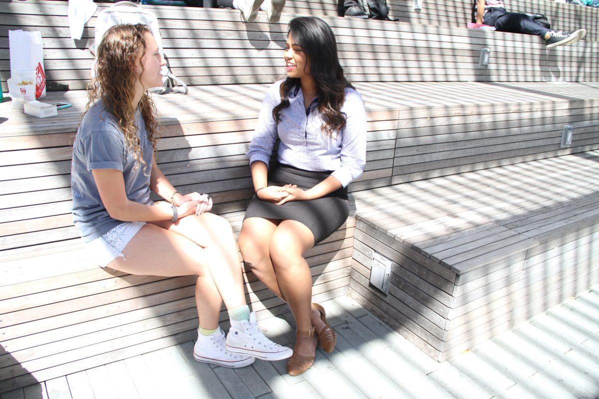 Akshitha Padigela (right), current SG president, explains the new constitution to Rebecca Macaluso, a biomedical engineering junior. The constitution will come into effect on May 1 with the new administration. Photo by Ruth Varghese | Mercury Staff.