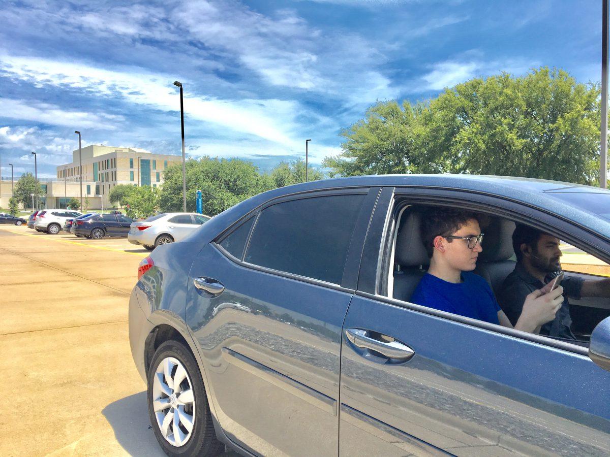 Sahil Ratra, a graduate management and administrative sciences  student, drives Carlos Angel, another student, utilizing the carpooling platform around campus. Photo courtesy of SnapRyde.