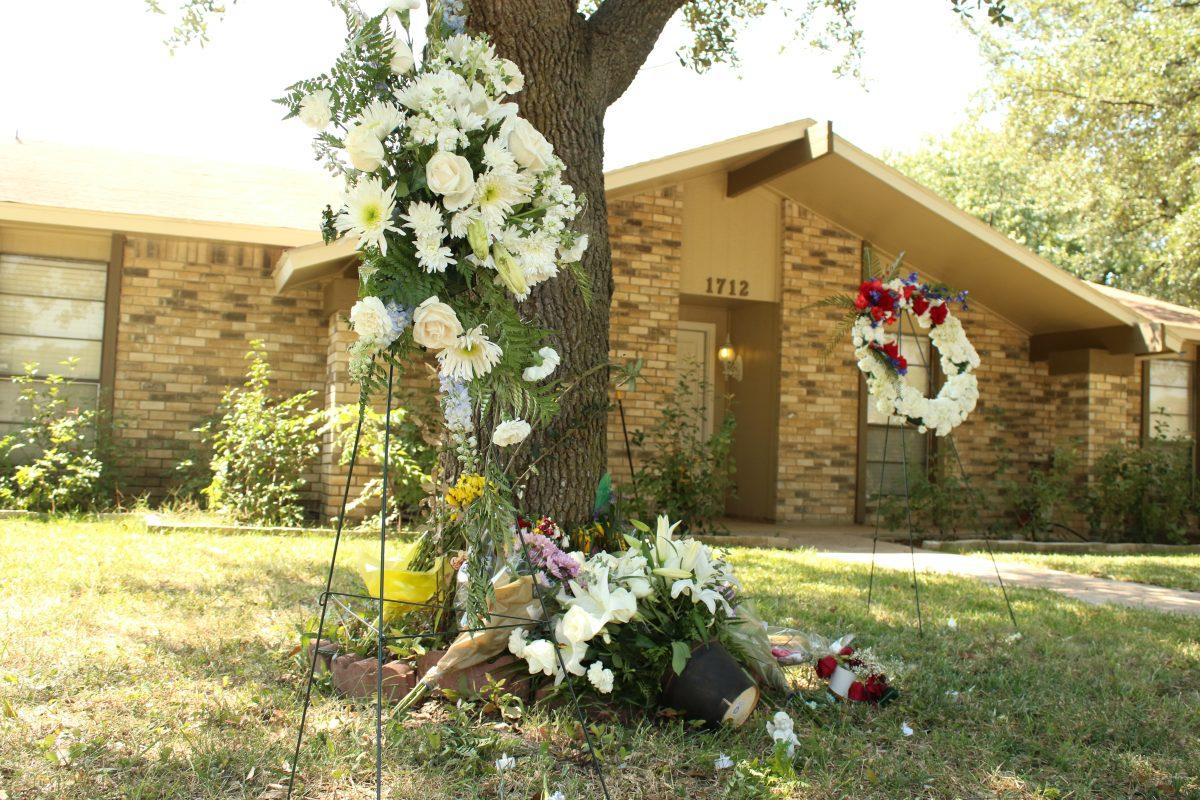 Family and friends created a makeshift memorial in front of the Plano home where former student Spencer Hight killed his estranged wife, Meredith Hight and seven other  people on Sept. 10. This shooting had the largest casuality in the city’s history. Photo by Saher Aqeel | Photo Editor.