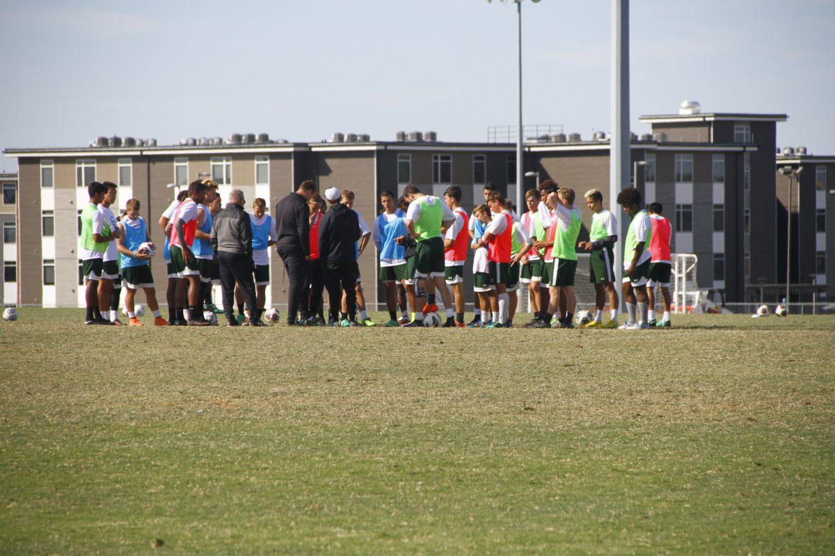 Members of the men’s soccer team participate in a practice on the campus fields. The team has over 40 players, nearly double the size of an average team. The men’s team was tabbed as favorites to win the ASC championship before the season began, but had a slow start to the season. They have a 7-5-1 record through the first 13 games of their 17 game season. Photo by Valerie Perez | Mercury Staff.