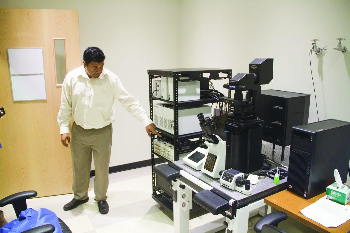 Jimmy Gowrisanker, director of Research Core Facilities, talks about new equipment capable of viewing live tissue cells at the Olympus Discovery Center. The Center opened on Sept. 13 with a ribbon cutting ceremony in the NSERL building. Photo by Michael Stout | Mercury Staff.