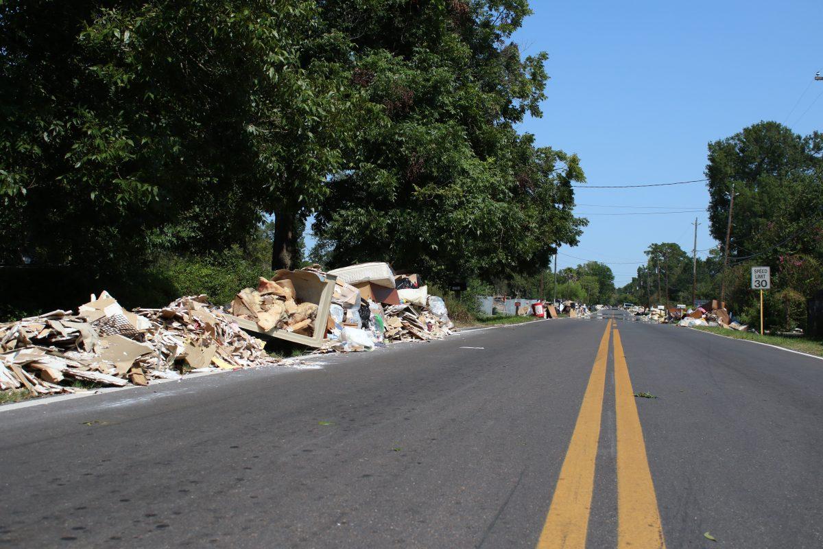 Debris lies on the side of a street near C.E. King High School in the Sheldon neighborhood of Houston. Hurricane Harvey made landfall in Texas on Aug. 26, causing widespread flooding and devastation. Photo by Saher Aqeel | Photo Editor.