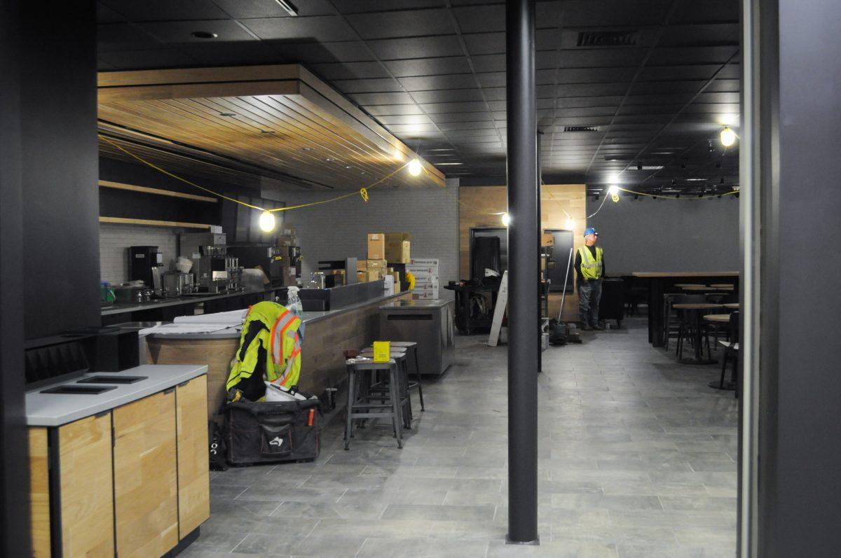 Construction workers put finishing touches on the new Starbucks on Nov, 10. It will be located on the second floor of the Student Union. Photo by Madeline Ambrose | Mercury Staff.