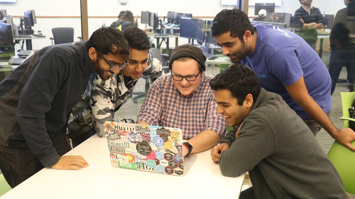 Karan Shukla (left) along with Saketh Nallaparaju, John Kahn, Bobby Thakkar and Swarn Singh competed in the HackTX 17 competition on Oct. 28. The team created Tunify, an app that puts collaborative playlists on a map that people can share, and took first place for Facebook’s “Community Building” award in the competition. Photo by Xiang Li | Mercury Staff.