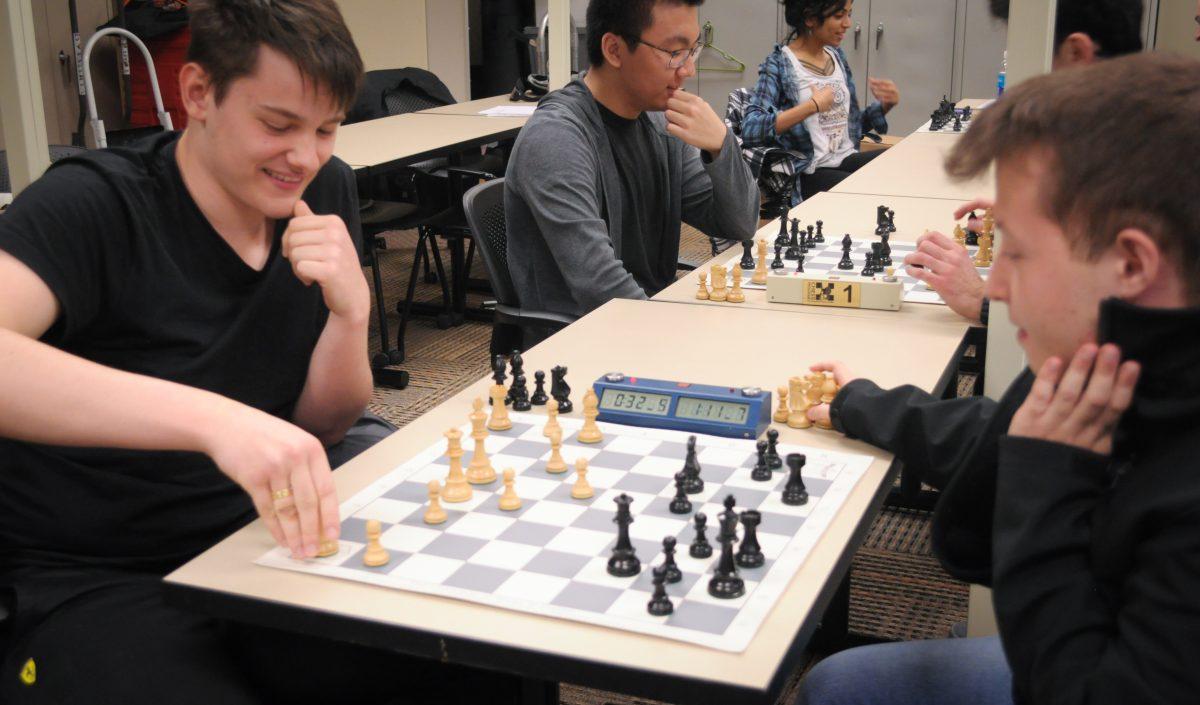 Finance and economics sophomore Titas Stremavicius (left) and computer science freshman Razvan Preotu practice on Jan. 19 for an upcoming match. Photo by Madeline Ambrose | Mercury Staff.
