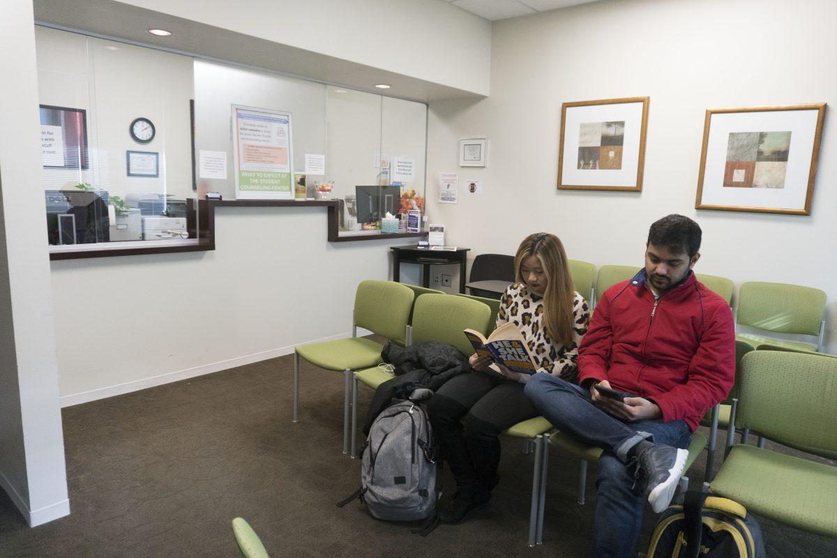 Computer science freshman Alexis Vu and business analytics graduate Prakhar Sharma wait for an appointment in the Student Counseling Center’s lobby. Photo by Anupam Gupta | Mercury Staff.