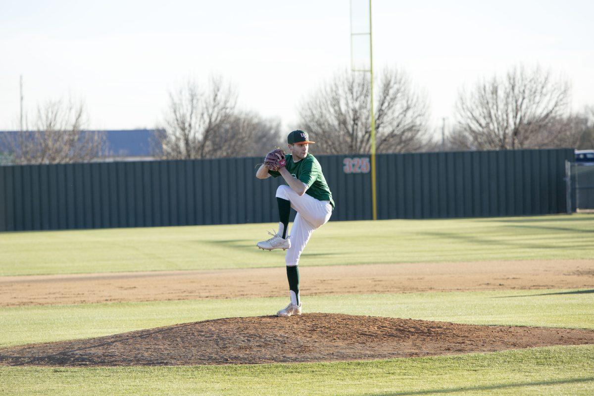 Senior pitcher Cole Hanson practices with the baseball team on Jan. 22. Photo by Ben Cannon | Mercury Staff.