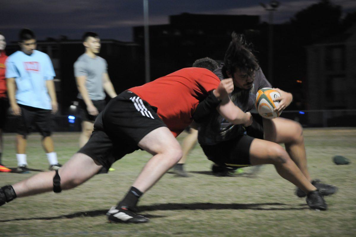 The UTD rugby team practices tackling drills at the fields on Feb. 15 in preparation for the upcoming playoffs. The playoff tournament will be held Feb. 24-25 at Angelo State University. Photo by Madeline Ambrose | Mercury Staff.