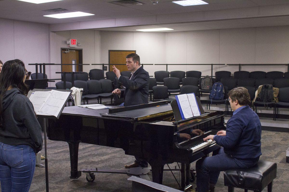 Professor Jonathan Palant directs the UTD University Choir during rehearsal on Feb. 13. Palant also directs a Dallas Street Choir for homeless people which he started three years ago. Last year, the street choir sang at Carnegie Hall. Photo by Michael Stout | Mercury Staff.