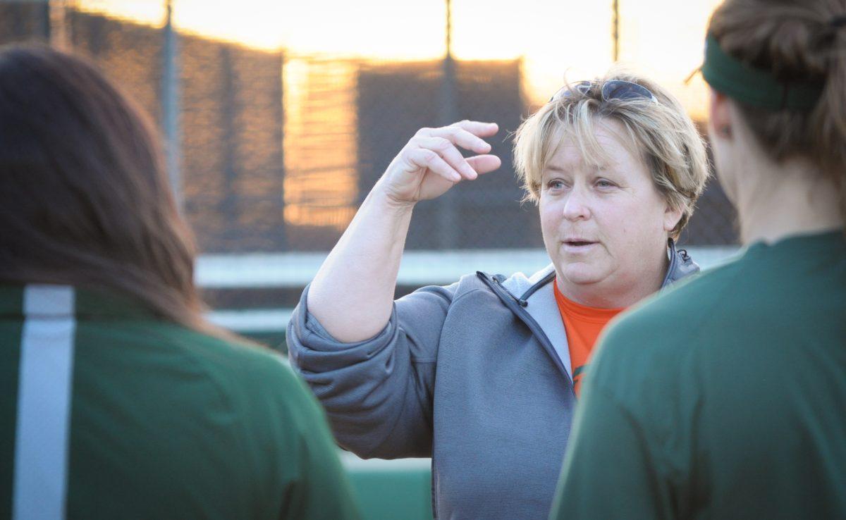 Interim head coach Corrie Hill practices drills with the softball team on March 8 in preparation for its upcoming home games. The Comets have gone 9-11 so far this season, including a five-game win streak from March 2-6. Photo by Madeline Ambrose | Mercury Staff.