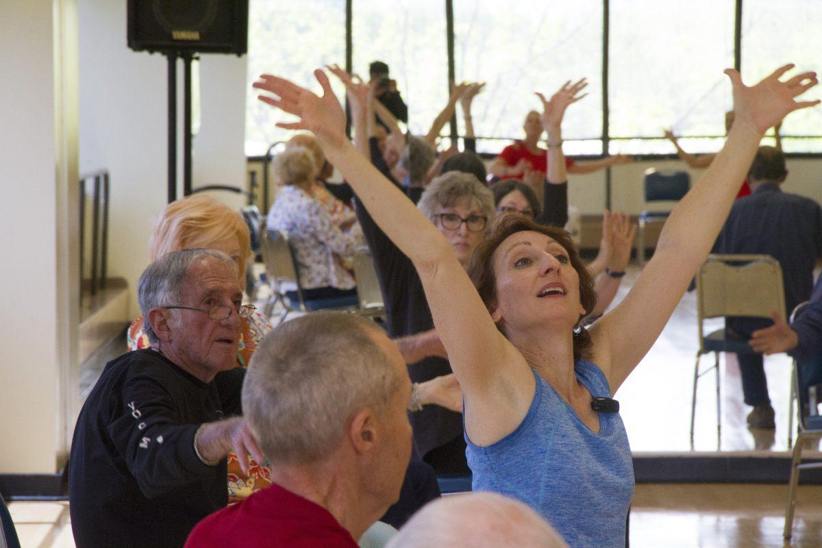 Misty Owens (center), an arts and humanities lecturer, teaches a class in association with Dance for Parkinson’s Disease, a global initiative to support individuals suffering from the neurodegenerative disorder. Photo by Achint Khanijo | Mercury Staff.