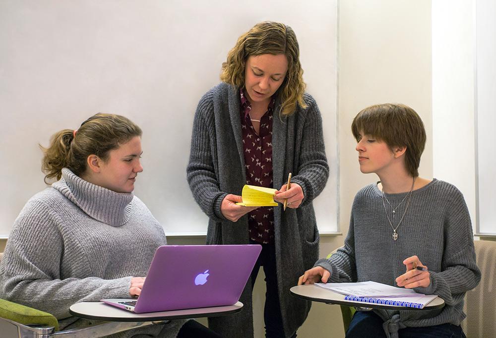 Doctoral student Sarah Gammell (left) and computer science sophomore Reagan Davis are part of a team collecting data on U.S. school shootings. Photo courtesy of UTD News Center.
