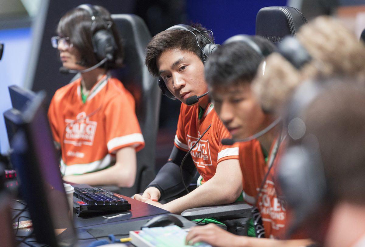 Finance junior Karlin Oei (center) was one of five students who represented UTD at the annual League of Legends College Championships, held in Los Angeles June 7-10. Photo courtesy of Riot Games.