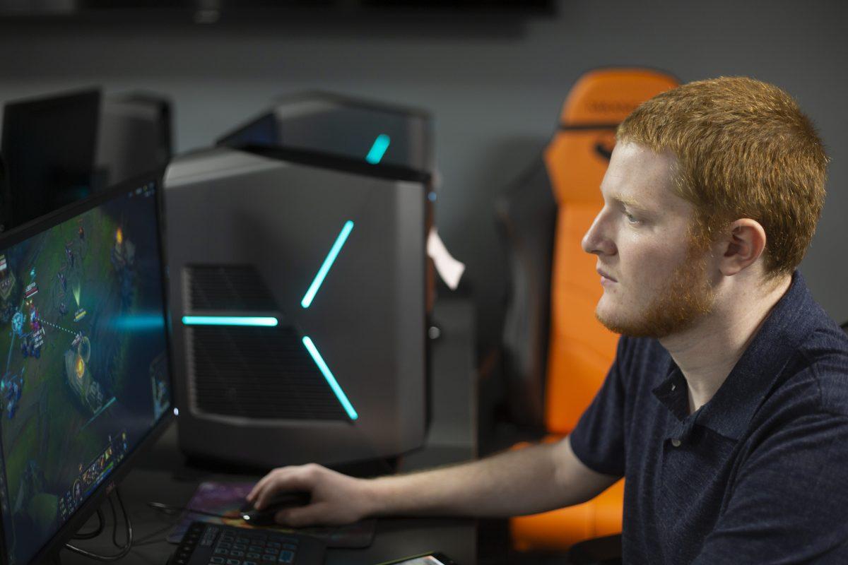Incoming esports coach Greg Adler plays “League of Legends” in the newly-constructed training room in the Student Union, which were formerly known as the Pegasus and Phoenix rooms. Adler said he hopes to build two five-player teams for “League of Legends” and two six-player teams for“Overwatch.” Tryouts begin Aug. 27 and end Sept. 6. Photo by Noah Whitehead | Photo Editor.