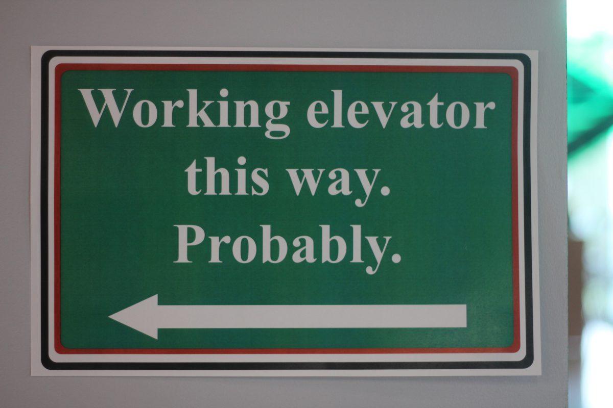 One of 200 signs posted in ECSW directs students to a working elevator. Photo by Michael Stout | Mercury Staff.