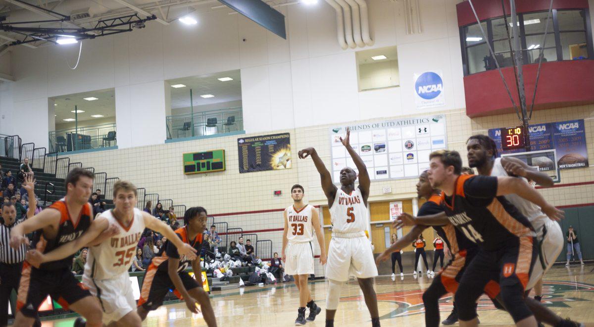 Healthcare studies freshman and guard Kavin Ezekwe shoots in the first half of the season opener against Hendrix College on Nov. 10. The Comets have an overall score of 6-2 so far this season. Photo by Noah Whitehead | Photo Editor.