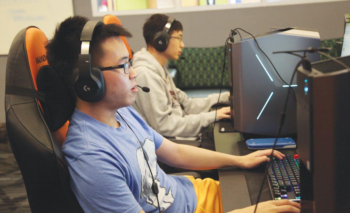 Finance junior Edward Liu “A Good Sir” and computer science freshman Andrew Fu “A Bad Sir” play as support and ADC on the League of Legends team. Photo by Pavan Tauh | Mercury Staff.