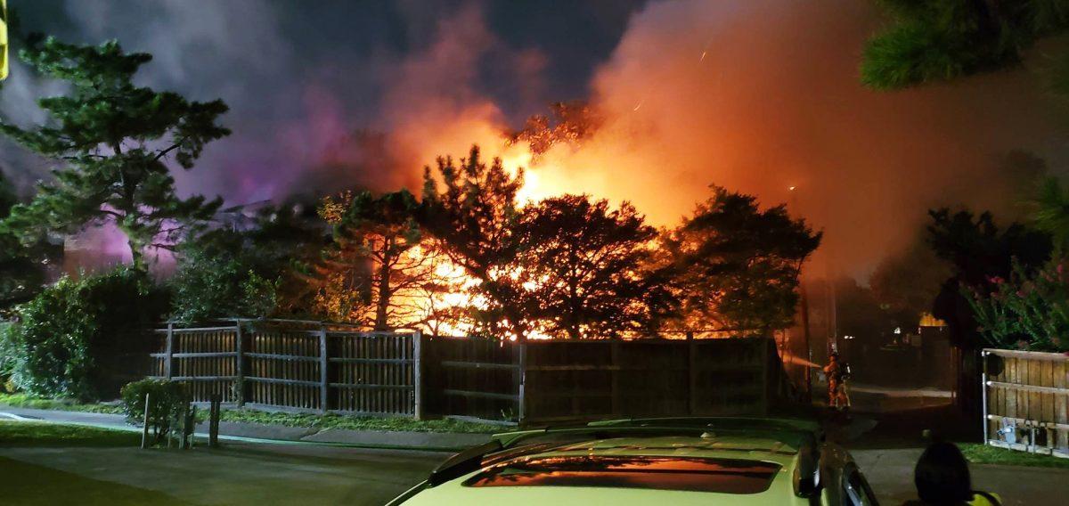 Eyewitnesses report that the fire nearly jumped across the alley to ignite another roof but was contained by the firefighters on-site. | Photo courtesy